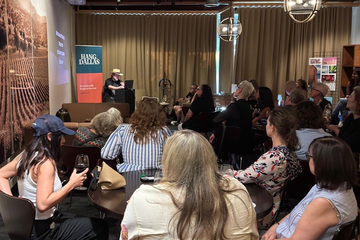 Guests seated at tables watching a speaker at a previous Hang Theory night at Times Ten Cellars in Dallas
